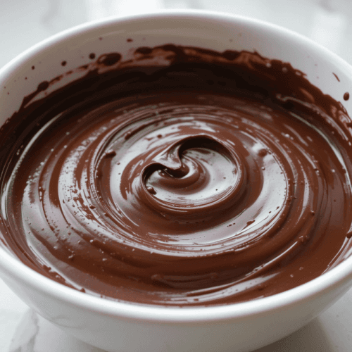 bowl of freshly made chocolate ganache with smooth